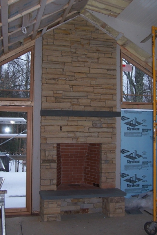 Interior masonry chimney in Vermont